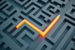Lit up arrow showing the way in a maze